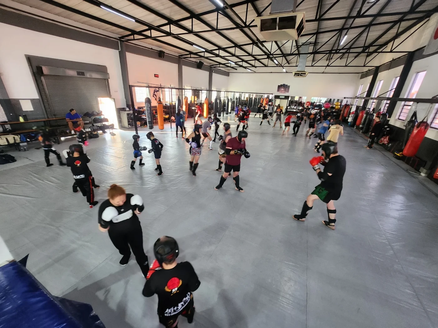 Kids training together on the Warrior Sports kids floor